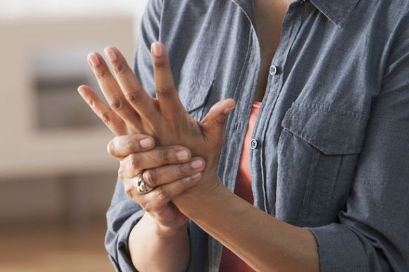 Older-Black-woman-rubbing-her-hands-Arthritis.jpg